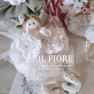 Bomboniere Battesimo bambolina bon bon con fiori